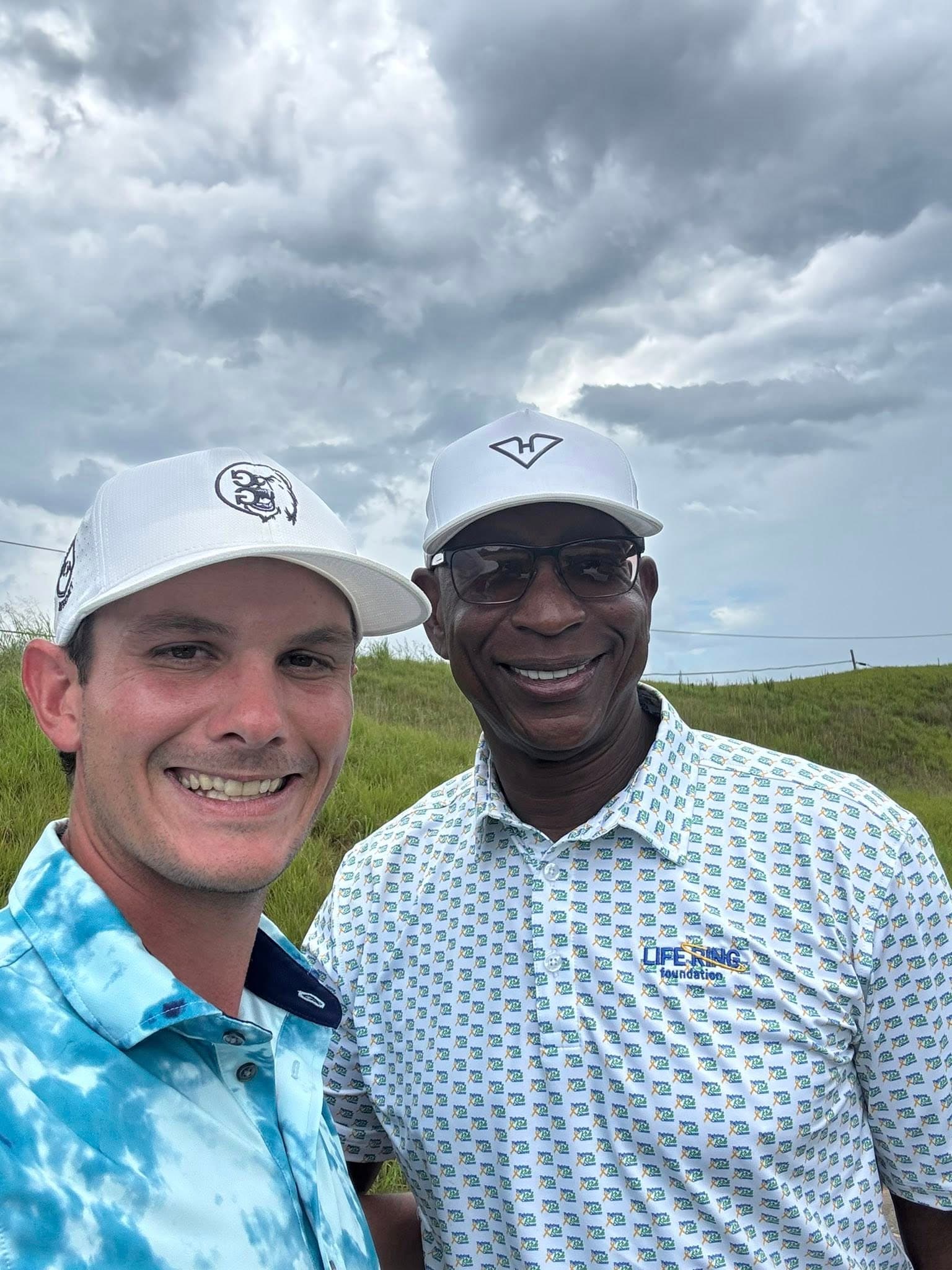 James Kasza with NFL Hall of Famer Eric Dickerson on the golf course